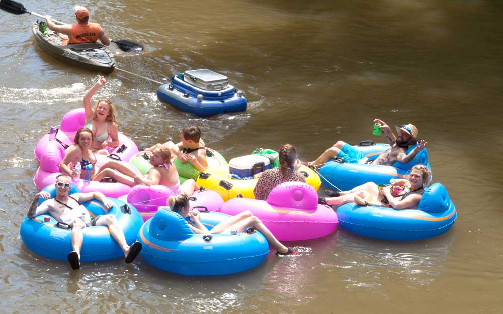People tubing the Rifle River from Russell Canoe and Campgrounds.